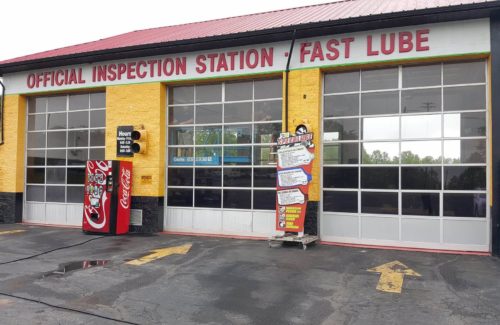 an auto body shop before garage door service