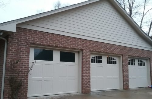 3 new residential garage doors installed with custom windows